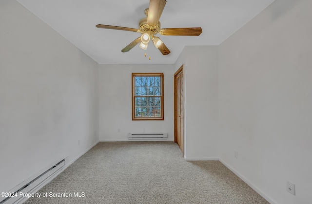 unfurnished room with light carpet, ceiling fan, and a baseboard radiator