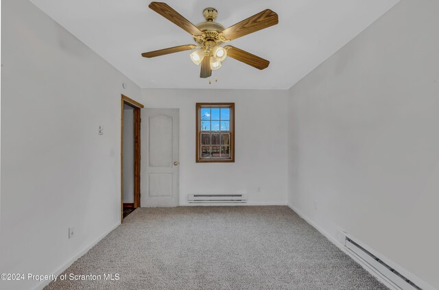 spare room featuring carpet flooring, ceiling fan, and a baseboard radiator