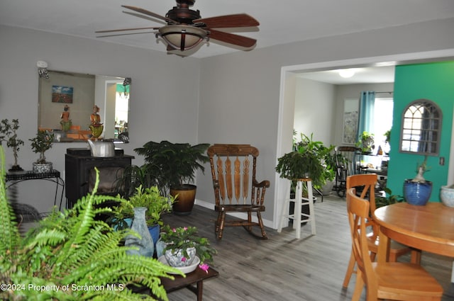 interior space with ceiling fan and light hardwood / wood-style floors