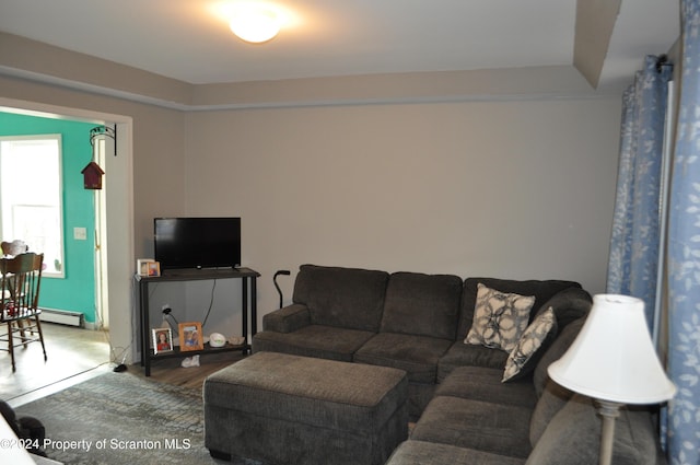 living room featuring a baseboard heating unit