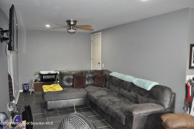 tiled living room featuring ceiling fan