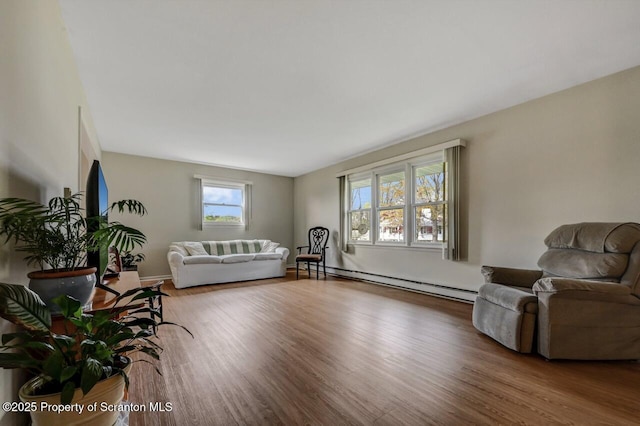 living room featuring a baseboard radiator and wood finished floors