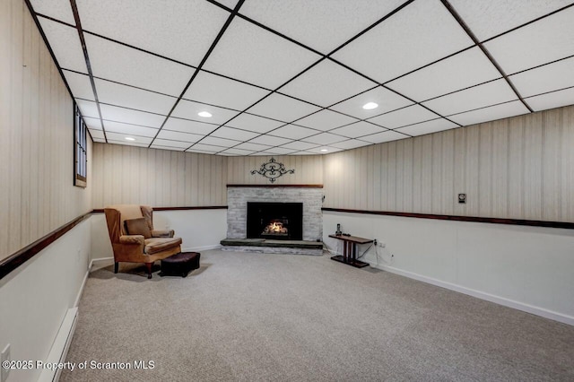 living room featuring carpet floors, baseboards, a brick fireplace, and recessed lighting