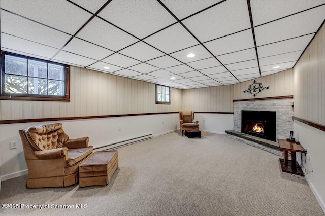 living area with baseboards, carpet, and a baseboard radiator