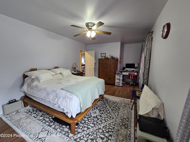 bedroom featuring ceiling fan and dark hardwood / wood-style flooring