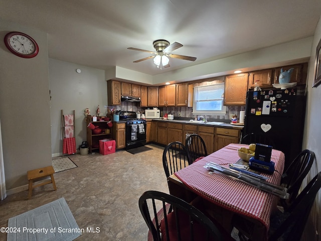 kitchen featuring decorative backsplash, ceiling fan, and black appliances