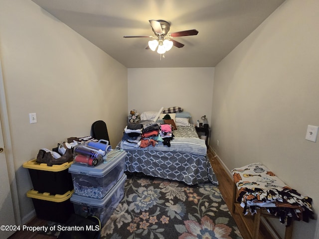 bedroom with hardwood / wood-style flooring and ceiling fan