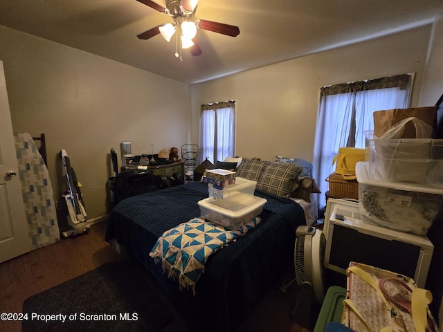 bedroom featuring ceiling fan and wood-type flooring