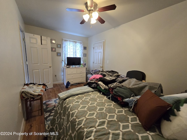 bedroom featuring ceiling fan and wood-type flooring