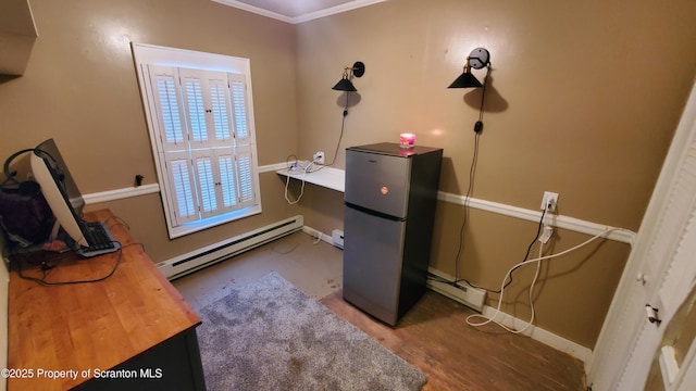 miscellaneous room with baseboards, a baseboard heating unit, and wood finished floors