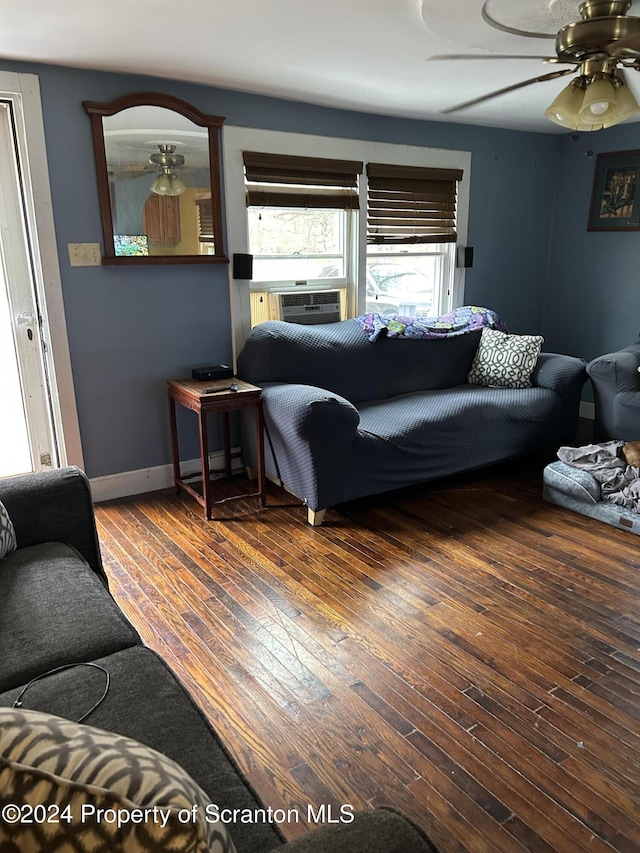 living room with hardwood / wood-style flooring and ceiling fan