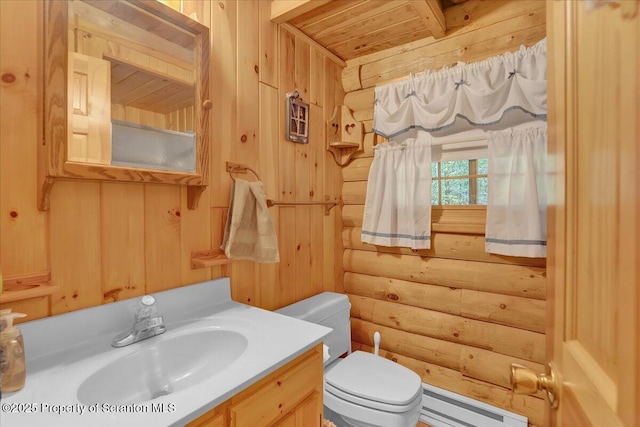 58 Sunset Dr, Clifton Twp, PA 18424 - bathroom with baseboard heating, log walls, toilet, wood ceiling with exposed beams, and vanity