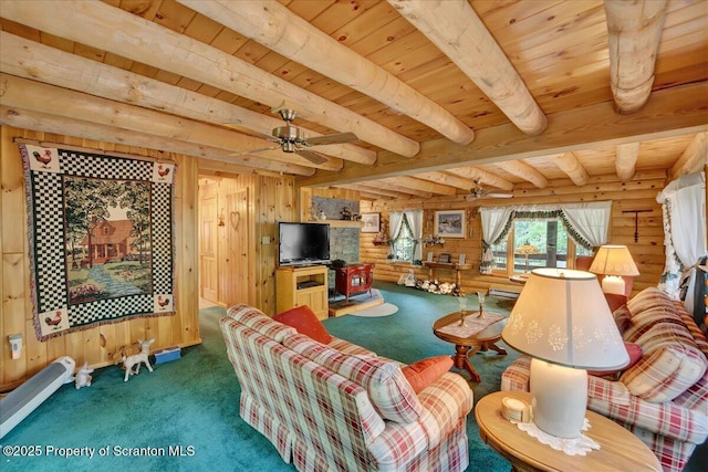 58 Sunset Dr, Clifton Twp, PA 18424 - carpeted living area with wooden ceiling with exposed beams, wood walls, ceiling fan, and a baseboard radiator