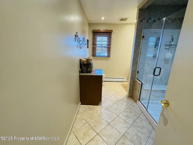 bathroom featuring a baseboard radiator, visible vents, a stall shower, tile patterned flooring, and baseboards