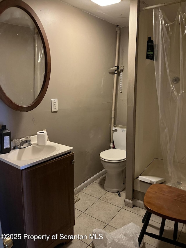 bathroom with vanity, tile patterned floors, toilet, and a shower with shower curtain