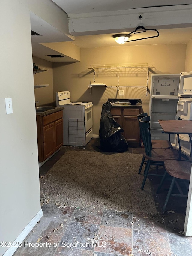 interior space with sink and electric range