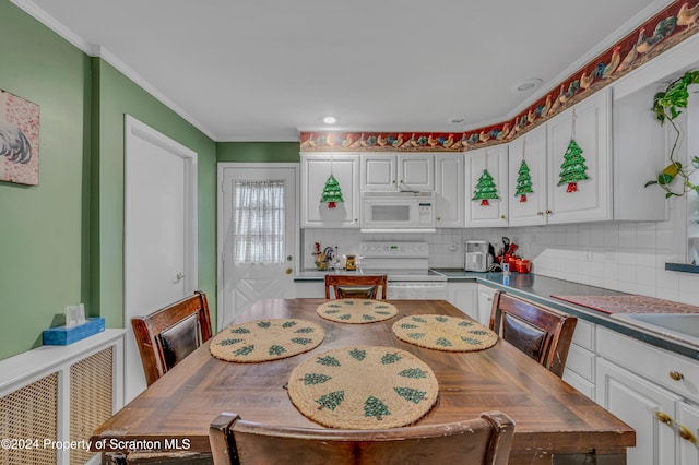 kitchen featuring white cabinetry, white appliances, ornamental molding, and tasteful backsplash