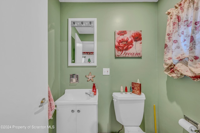 bathroom featuring toilet and sink