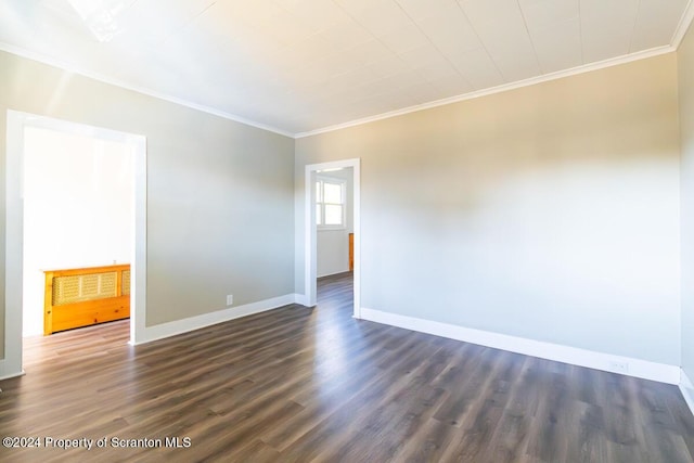 unfurnished room with dark hardwood / wood-style floors and ornamental molding