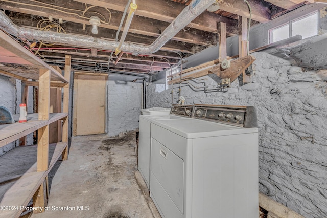 basement featuring washing machine and clothes dryer