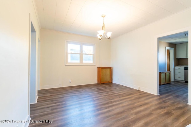 empty room with a chandelier, crown molding, and dark wood-type flooring