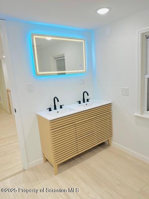 bathroom featuring sink and wood-type flooring