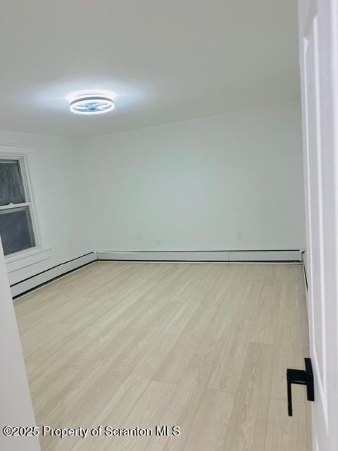 spare room with light hardwood / wood-style floors