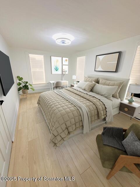 bedroom with light hardwood / wood-style floors