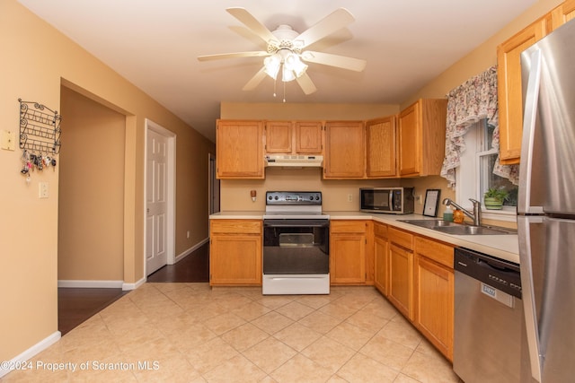 kitchen with ceiling fan, sink, and stainless steel appliances