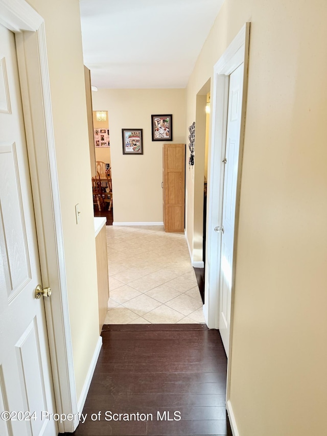 hallway featuring light tile patterned floors