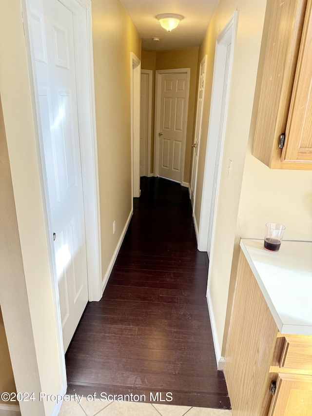 hallway featuring dark hardwood / wood-style floors