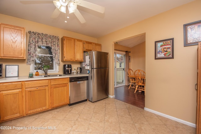 kitchen featuring ceiling fan, light tile patterned floors, sink, and appliances with stainless steel finishes