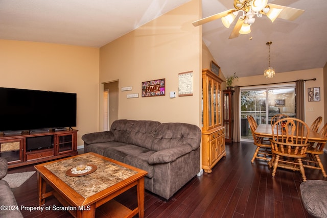 living room with dark hardwood / wood-style flooring, vaulted ceiling, and ceiling fan