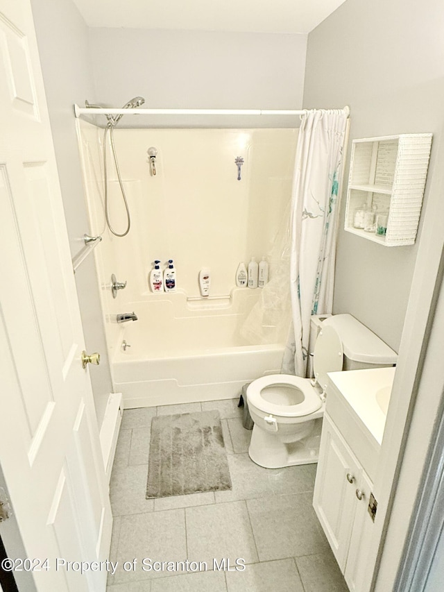 full bathroom featuring tile patterned floors, shower / bathtub combination with curtain, vanity, and toilet