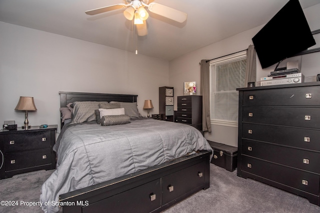 bedroom with light colored carpet and ceiling fan