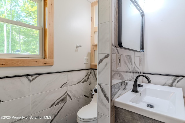 977 Laurel Ln, Kingsley, PA 18826 - half bathroom featuring tile walls and healthy amount of natural light