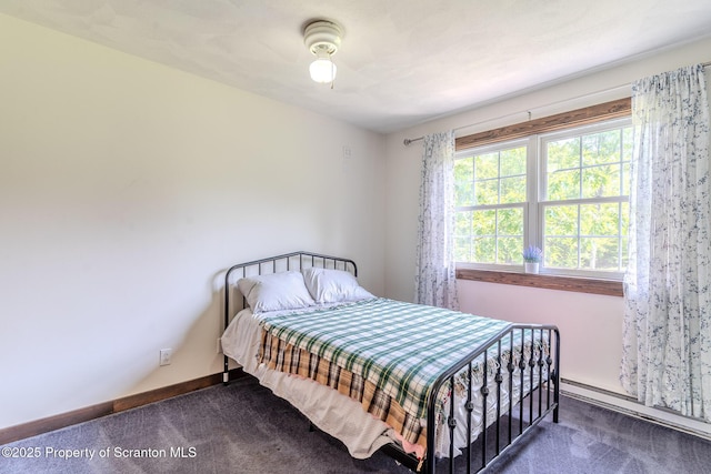 977 Laurel Ln, Kingsley, PA 18826 - carpeted bedroom featuring a baseboard heating unit and baseboards