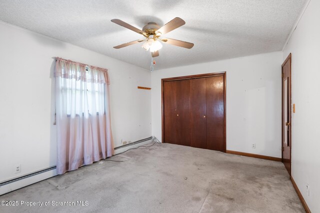 5 Patti Ann Dr, Scott Twp, PA 18433 - unfurnished bedroom featuring a baseboard heating unit, a closet, carpet, a textured ceiling, and a ceiling fan