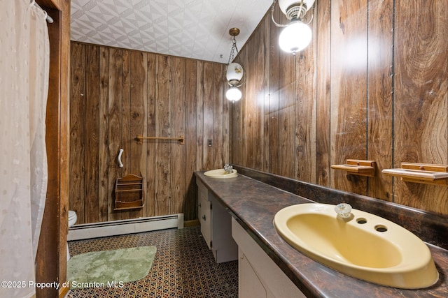 5 Patti Ann Dr, Scott Twp, PA 18433 - bathroom with a baseboard heating unit, wooden walls, double vanity, and an ornate ceiling