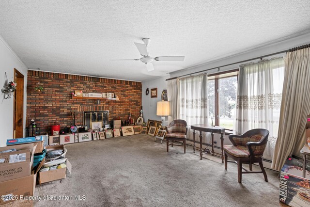 5 Patti Ann Dr, Scott Twp, PA 18433 - living room with a textured ceiling, brick wall, ceiling fan, carpet, and a baseboard radiator