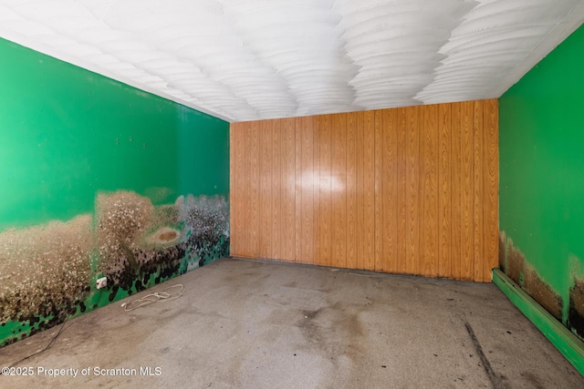 5 Patti Ann Dr, Scott Twp, PA 18433 - empty room with wooden walls and a baseboard heating unit
