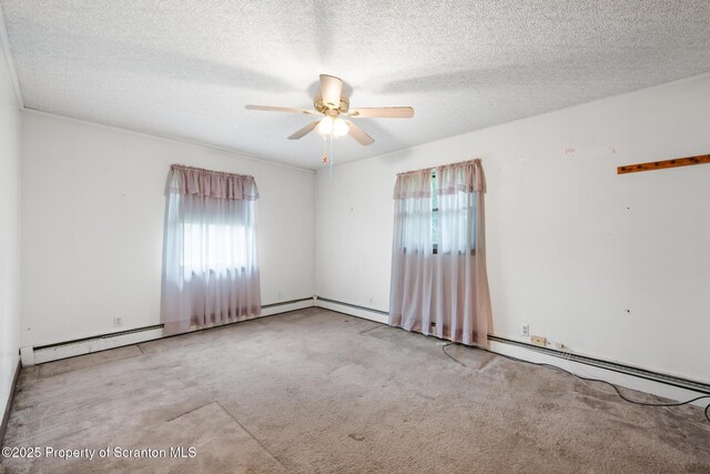 5 Patti Ann Dr, Scott Twp, PA 18433 - carpeted empty room featuring plenty of natural light, ceiling fan, a baseboard heating unit, and a textured ceiling