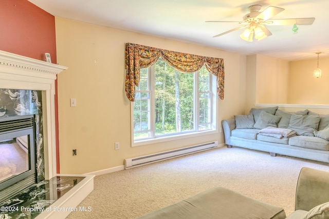 carpeted living room featuring ceiling fan and a baseboard radiator