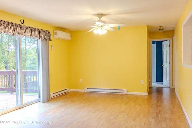 spare room featuring a wall mounted AC, light hardwood / wood-style flooring, baseboard heating, and ceiling fan