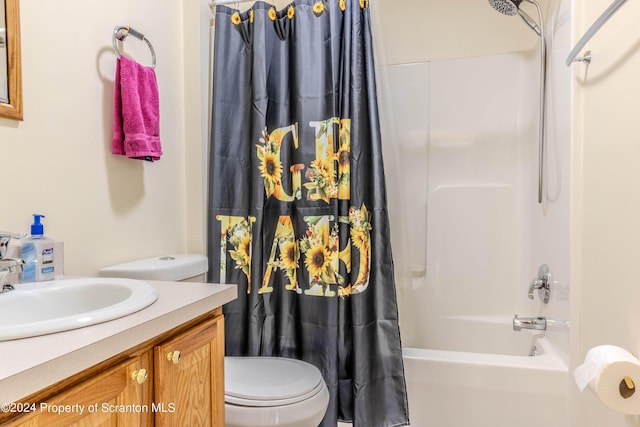 full bathroom with vanity, toilet, and shower / bath combo with shower curtain