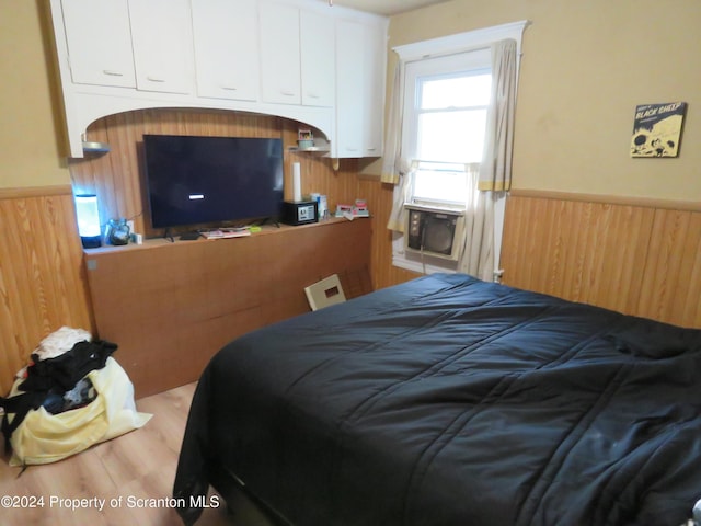 bedroom featuring hardwood / wood-style flooring and a closet