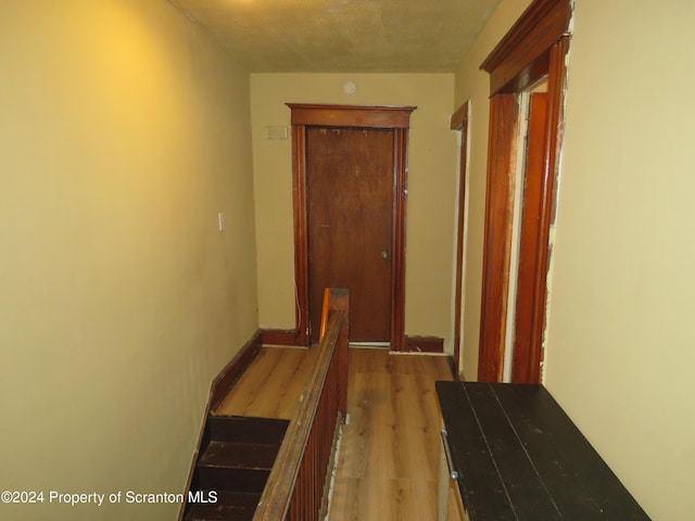 corridor featuring hardwood / wood-style flooring