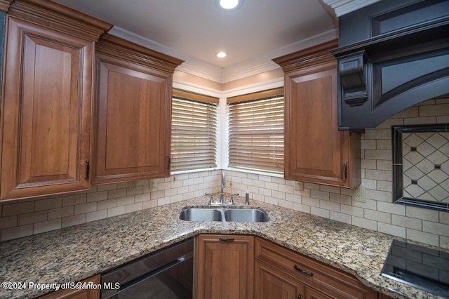 kitchen with backsplash, light stone counters, ornamental molding, sink, and black appliances