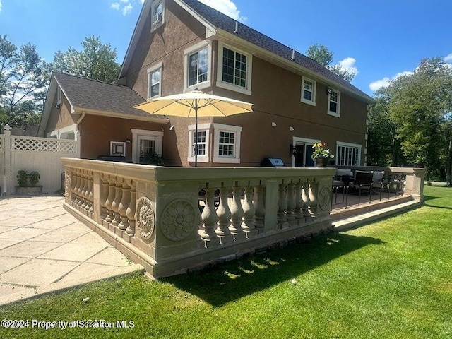 rear view of house with a lawn