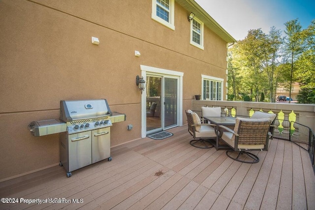 wooden deck with area for grilling